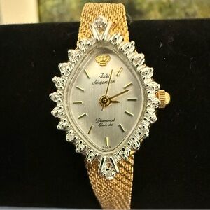 Vintage Jules Jorgensen ladies wristwatch with genuine diamonds gold tone.l